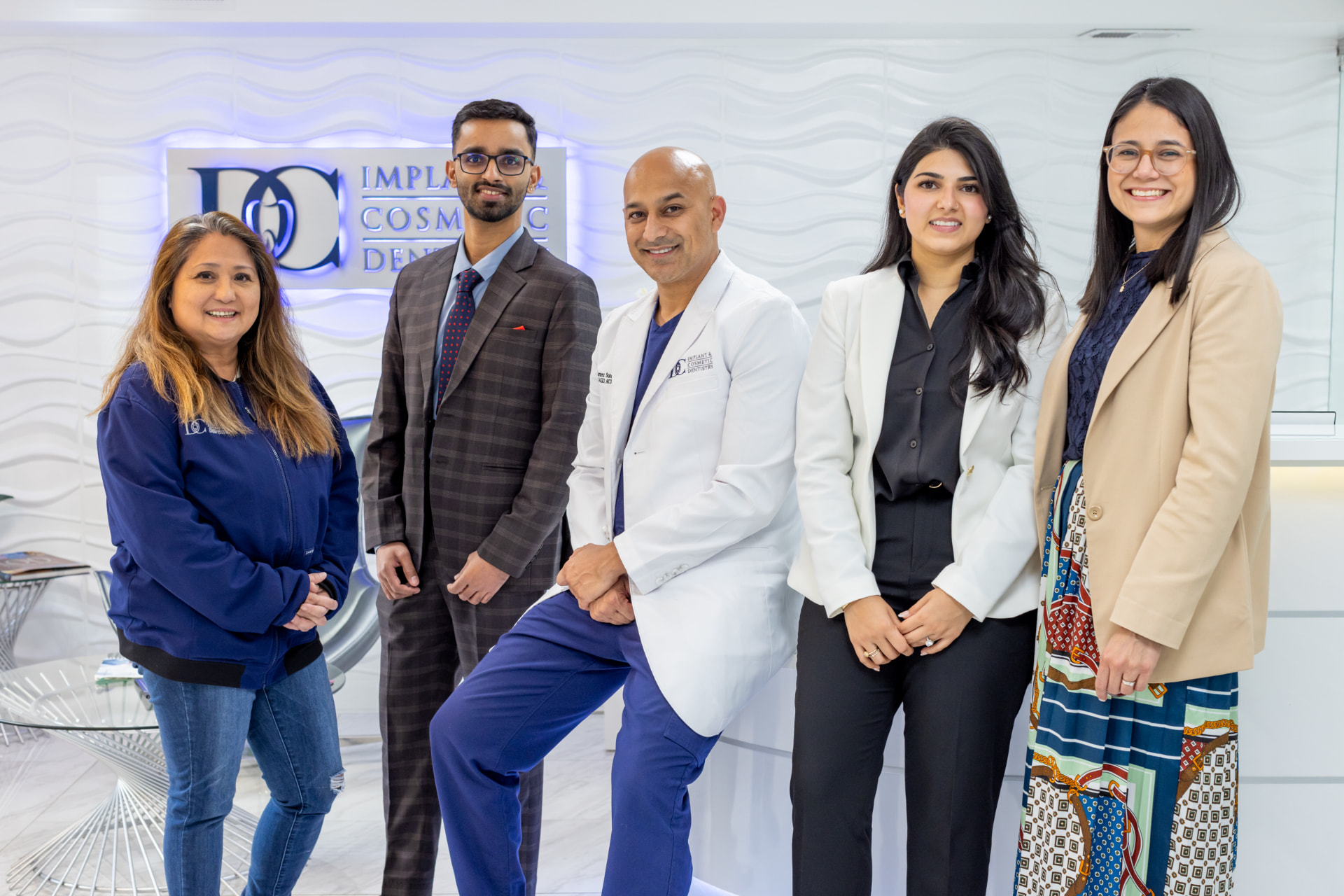 Dr. Kambez Shukoor with the DC Implant & Cosmetic Dentistry team in their Washington, DC office