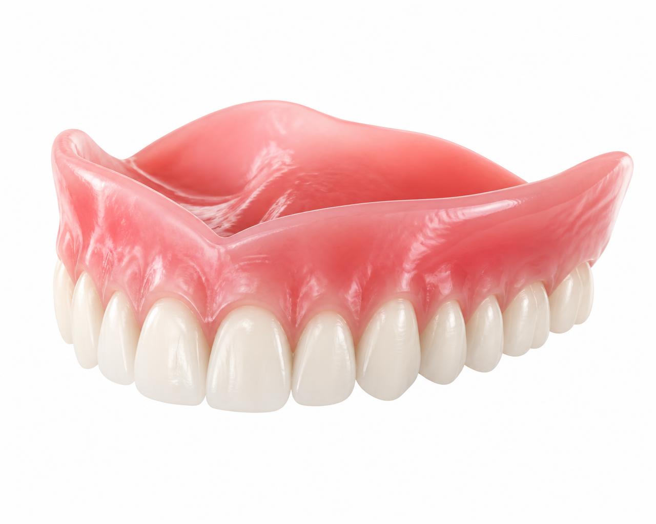 Complete removable upper denture with a pink acrylic base and a full arch of natural-looking replacement teeth